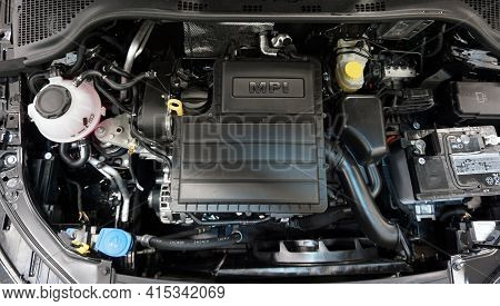 Modern Engine. Top View. On The Intake Manifold There Is The Mpi Lettering. Selected Focus.