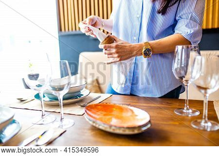 Portrait Of One Young Beautiful Caucasian Woman Washing A Dishes And Table Setting Daylight
