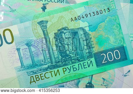 Russian Banknotes Of 200 Rubles. Tinted Background. Unusual Catchy Backdrop Or Wallpaper On The Them