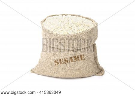 Seeds Of Sesame In A Sack Of Isolated On A White Background. Til In A Burlap Sack. Healthy Food. Ben