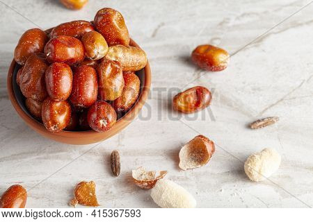 Ripe Fruits Of Cultivated Eleagnus (silverberry) Plants. The Nut Sized Brown Fruit Has A Thin Skin. 