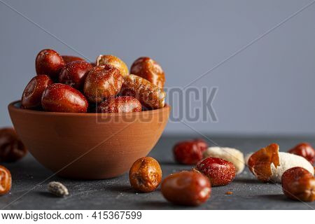 Ripe Fruits Of Cultivated Eleagnus (silverberry) Plants. The Nut Sized Brown Fruit Has A Thin Skin. 
