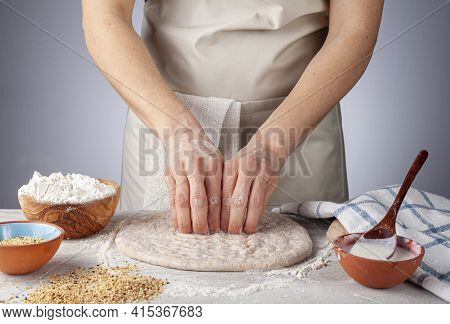 Preparation Of Homemadeturkish Flat Bread, Pide Or Pizza Base In The Kitchen. A Woman Chef Is Making