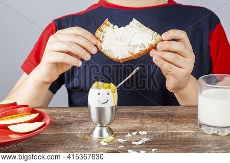 Breakfast Table With Simple Balanced Nutritious Ingredients. A Soft Boiled Egg With Face Painted On,