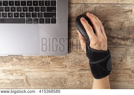 Chronic Trauma To The Wrist Joint  In People Using Computer Mouse May Lead To Disorders That Cause I