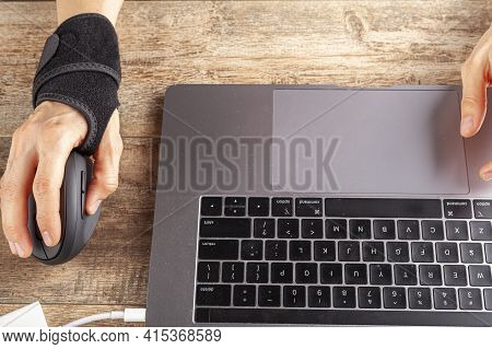 Chronic Trauma To The Wrist Joint  In People Using Computer Mouse May Lead To Disorders That Cause I