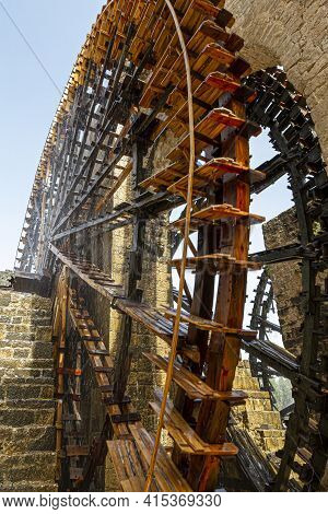 Historic Water Wheels Called As Norias In The Syrian City Of Hama. Wooden Turbines Pull Water From T
