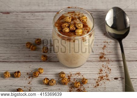 Boza is a fermented malt drink made of barley, corn, wheat in Turkey and middle east. It is served w