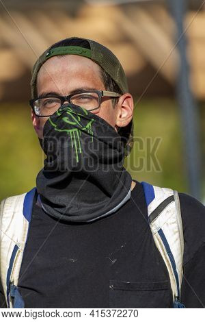 Ellicott City, Md, Usa 10/07/2020: A Young Caucasian Male Wearing A Base Ball Hat Backwards And A La