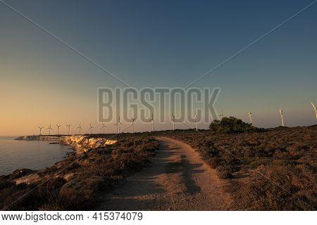 A Landscape Image Taken On The Western Cape  Of Bozcaada, Turkey. Image Shows The Scenic Wind Farm, 