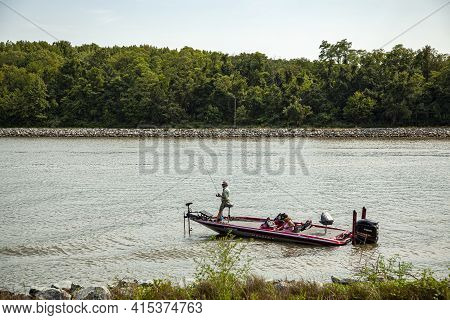 Chesapeake City, Md, Usa 08/25/2020: An Elderly Couple Is Seen On A Red Phoenix Bass Fishing Boat In