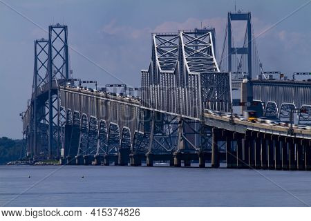 Day Time Telephoto Long Exposure Image Showing The Rush Hour Traffic On Chesapeake Bay Bridge. It Fe