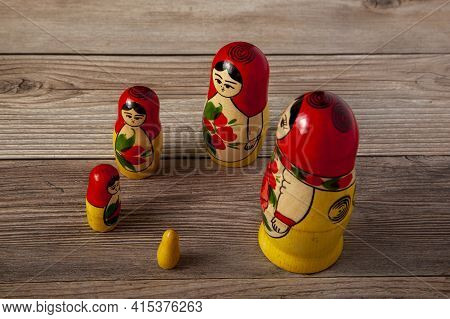 A Close Up Isolated Image Of A Set Of Handmade Russian Matrushka Dolls That Are Lined Up Around A Ci
