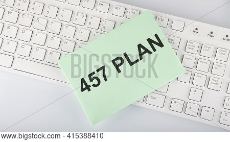 Text 457 Plan On Envelope On Keyboard On White Background