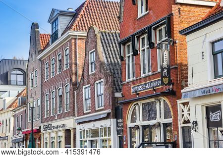 Purmerend, Netherlands - March 31, 2021: Red Brick Facades Of Bars And Cafes In Purmerend, Netherlan