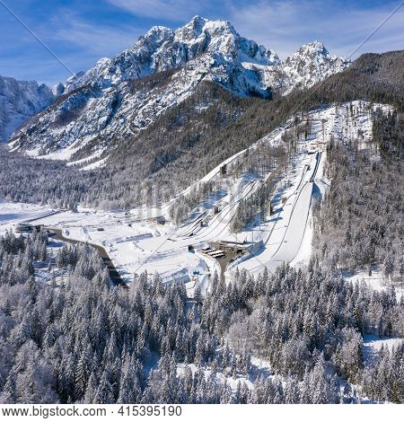 Aerial View Of Ski Jump In Planica, Slovenia At Ratece Near Kranjska Gora In Winter With Snow.