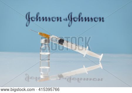 Johnson And Johnson Coronavirus Vaccine Vial And Syringe With Logo As Background. Ljubljana, Sloveni