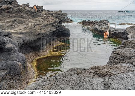 Sao Miguel , Portugal - August 2020:  Natural Pool At Caneiros , Sao Miguel, Azores Islands, Portuga