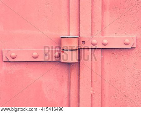 Safety Anti Thef Latch Lock On Warehouse Door. Industrial Kind Of Gate Door With Obsolete Red Paint.