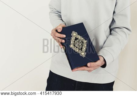 Ramadan Concept With Man Holding Quran . High Quality And Resolution Beautiful Photo Concept