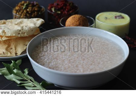 Rice Porridge Or Kanji Along With Coconut Chutney, Beetroot Potato Thoran, Stir Fried Moong, Fried P