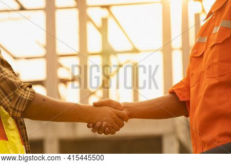 The Contractor And The Supervisor Shook Hands After Inspecting The Site,
