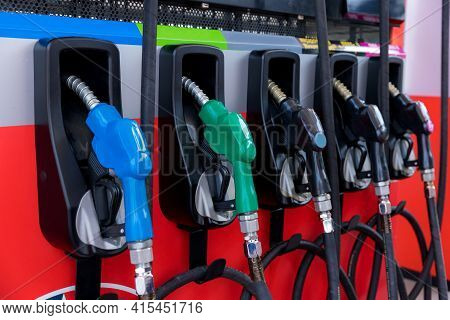 Fuel Pump, Gas Station, Gasoline. Colorful Petrol Pump Filling Nozzles Isolated On White Background 