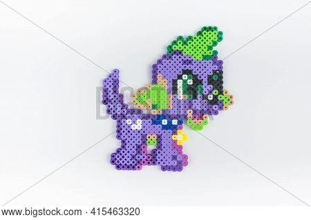 Perler Bead Purple Dog. White Isolated Background.