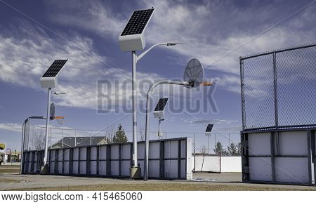 Solar Powered Street Lights Recharge In The Daylight At An Outdoor Recreation Court In Airdrie Alber