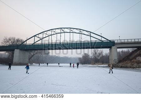 Pancevo, Serbia - January 22, 2017: People, Mainly Children Playing And Walking On Frozen Timis Tami