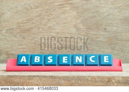 Tile Alphabet Letter With Word Absence In Red Color Rack On Wood Background