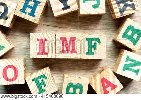 Alphabet Letter Block In Word Imf (abbreviation Of International Monetary Fund) With Another On Wood