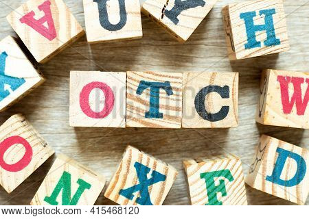 Alphabet Letter Block In Word Otc (abbreviation Of Over The Counter) With Another On Wood Background