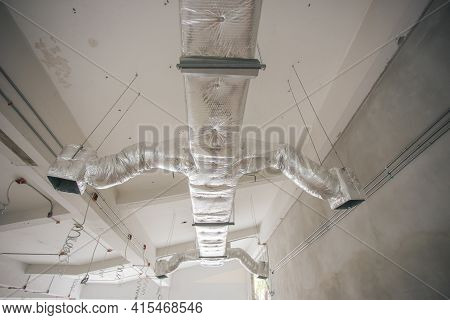 Ducting Work For Air Conditioner Ceiling Type. Installation Ac Ductwork In The Construction Site.