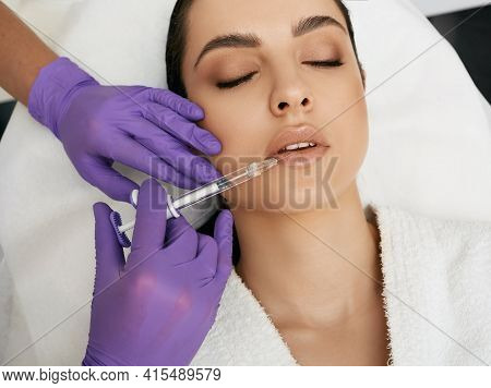 Lips Filler Injection For Beautiful Woman Lip Augmentation With Hyaluronic Acid At A Beauty Salon