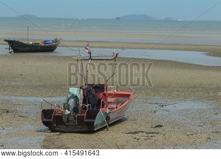 Fisherman's Fishing Boat On Sand At A Fishing Village Beach There Is An Island And Sea Background Wi