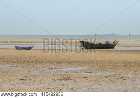 Fisherman's Fishing Boat On Sand At A Fishing Village Beach There Is An Island And Sea Background Wi