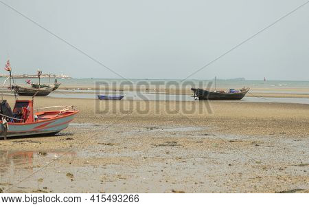 Fisherman's Fishing Boat On Sand At A Fishing Village Beach There Is An Island And Sea Background Wi