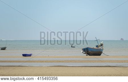 Fisherman's Fishing Boat On Sand At A Fishing Village Beach There Is An Island And Sea Background Wi
