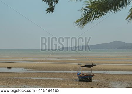 Fisherman's Fishing Boat On Sand At A Fishing Village Beach There Is An Island And Sea Background Wi