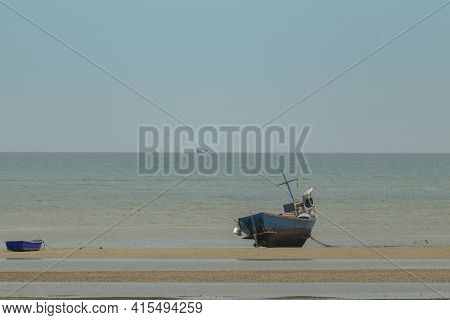 Fisherman's Fishing Boat On Sand At A Fishing Village Beach There Is An Island And Sea Background Wi