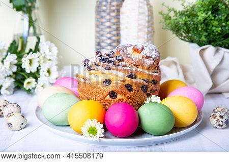 Craffin (cruffin) With Raisins And Candied Fruits. Easter Bread Kulich And Painted Eggs. Easter Holi