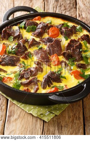 Montenegrin Cuisine Boiled And Then Baked Beef With Egg-milk Sauce Close-up In A Frying Pan On The T