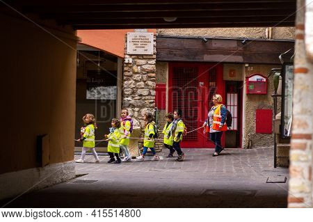 Sirmione, Italy-october 9, 2018: Children March In Formation In The Town Of Sirmione Near Scaligera