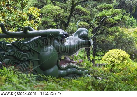 A Dragon Head Statue Within Ding Xiang Garden On The Puxi Side Of Shanghai China.
