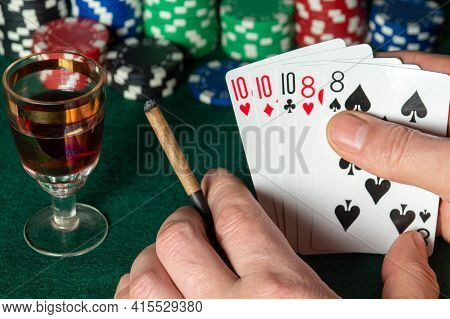 Poker Cards With Full House Or Full Boat Combination. Close Up Of A Gambler Hand Is Holding Playing 