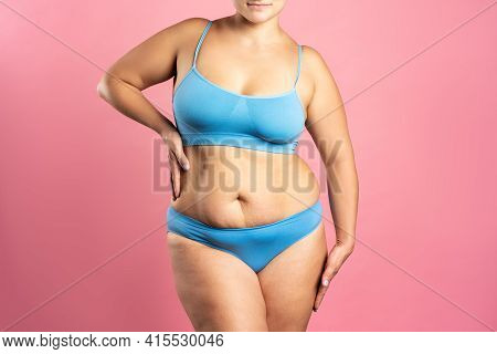 Fat Woman In Blue Underwear On Pink Background, Overweight Female Body