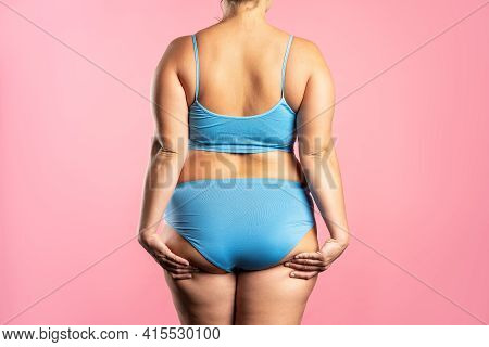 Overweight Woman With Fat Hips And Buttocks, Obesity Female Body On Pink Background
