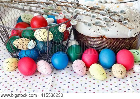 Easter Cake With Glace Icing And Easter Eggs On White Lace Tablecloth.  
Traditional Christian Easte