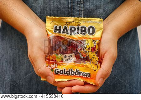 Tambov, Russian Federation - January 06, 2021 Woman Palms With Pack Of Haribo Bears Gummy Candies.